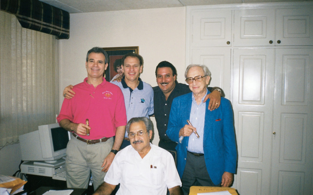 Drew Eric and Stanford Newman with Carlos and Carlos Jr. Fuente