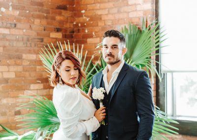 bride and groom in front of plant at jc newman cigar company factory tampa