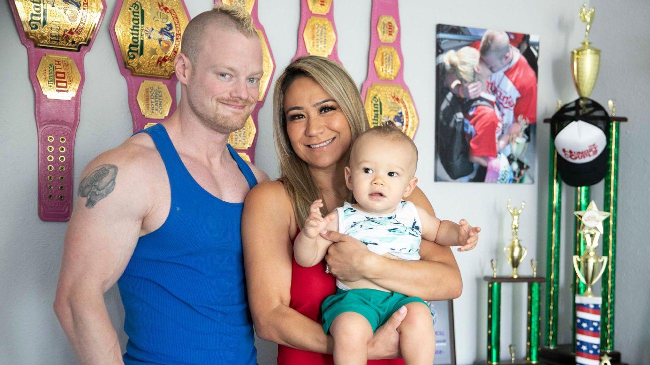 miki and nick with miki's championship belts in the background