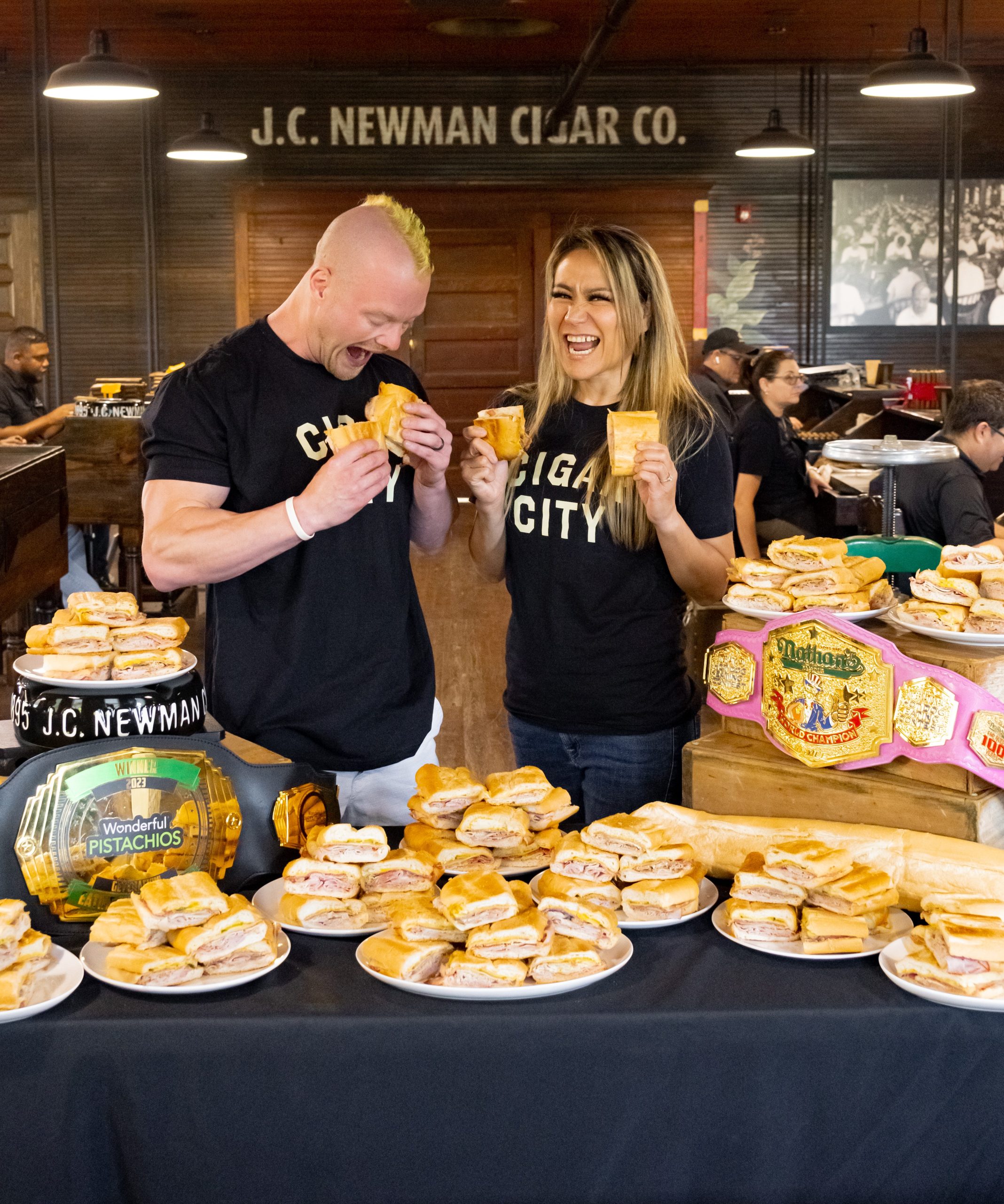 Miki Sudi and Nick Wehry pose with Cuban Sandwiches