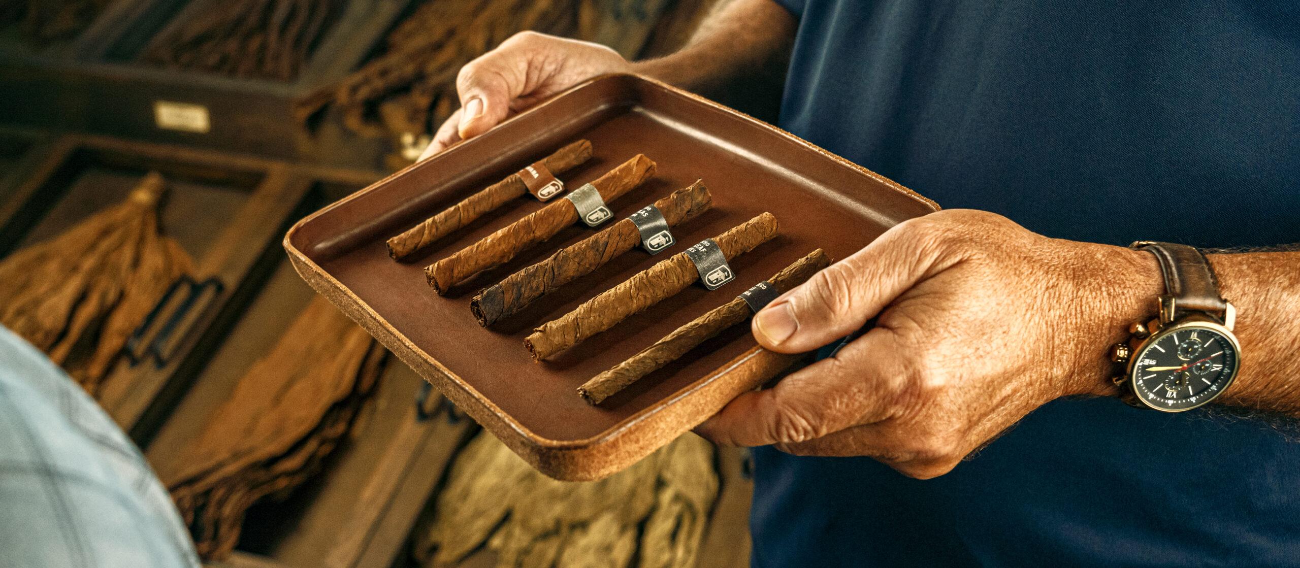 J. C. Newman employee holding a tray of puritos